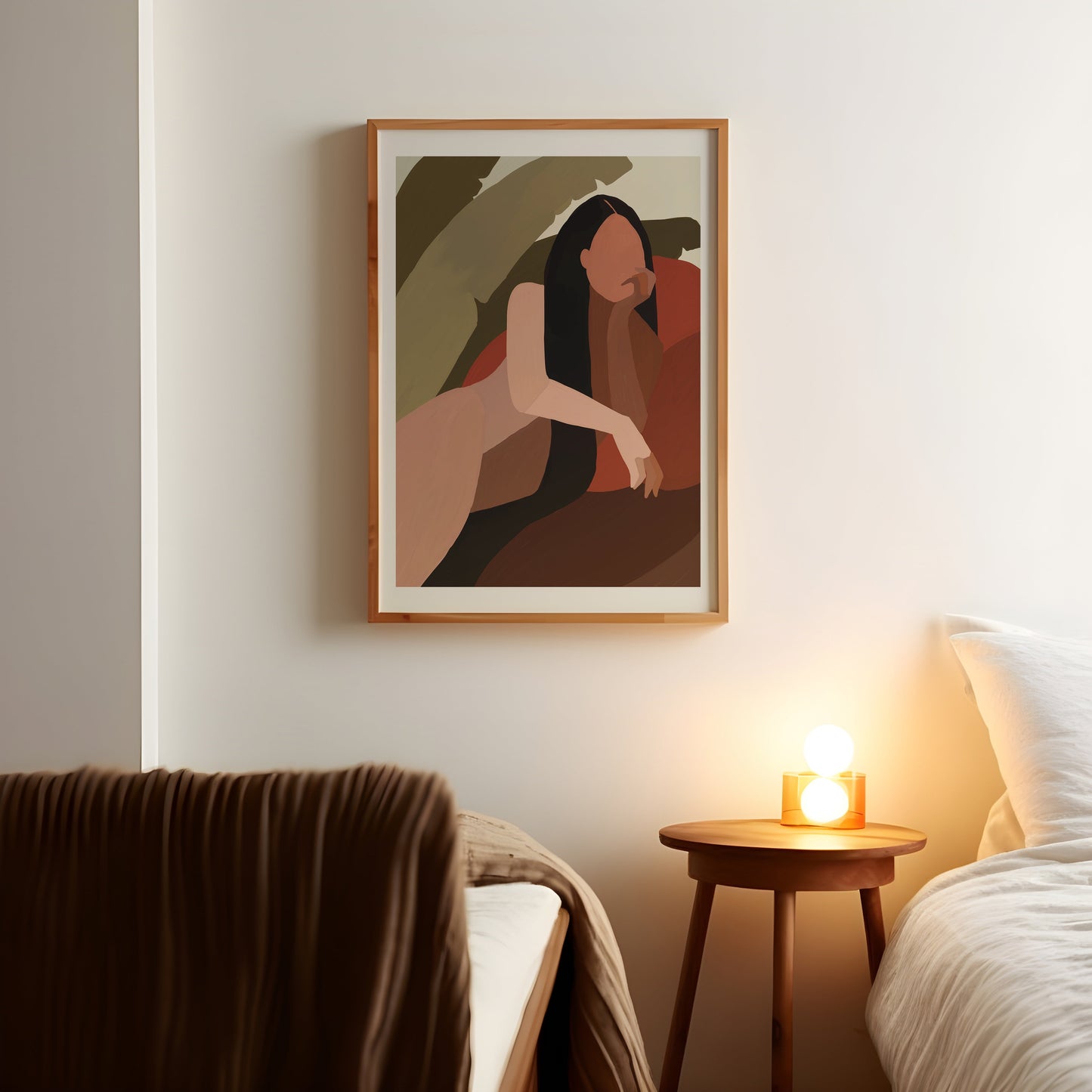 a picture of a woman on a wall above a bed
