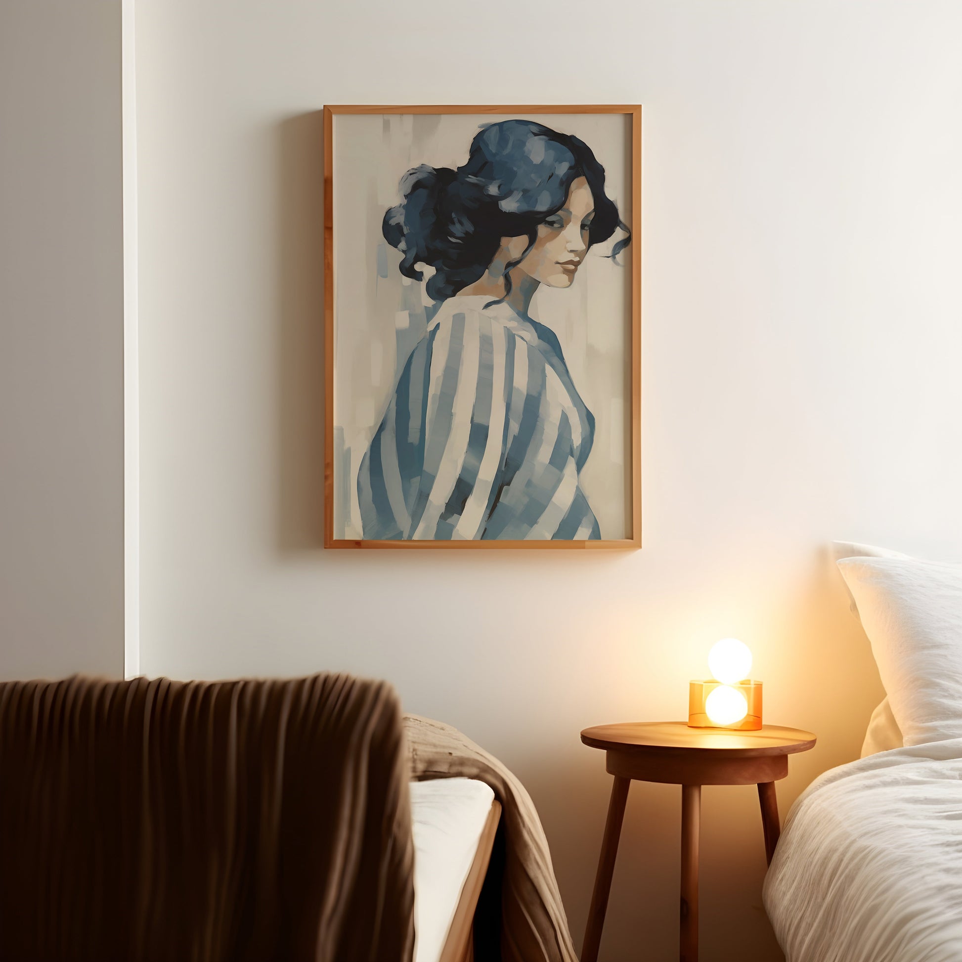 a painting of a woman in a striped shirt hangs above a bed