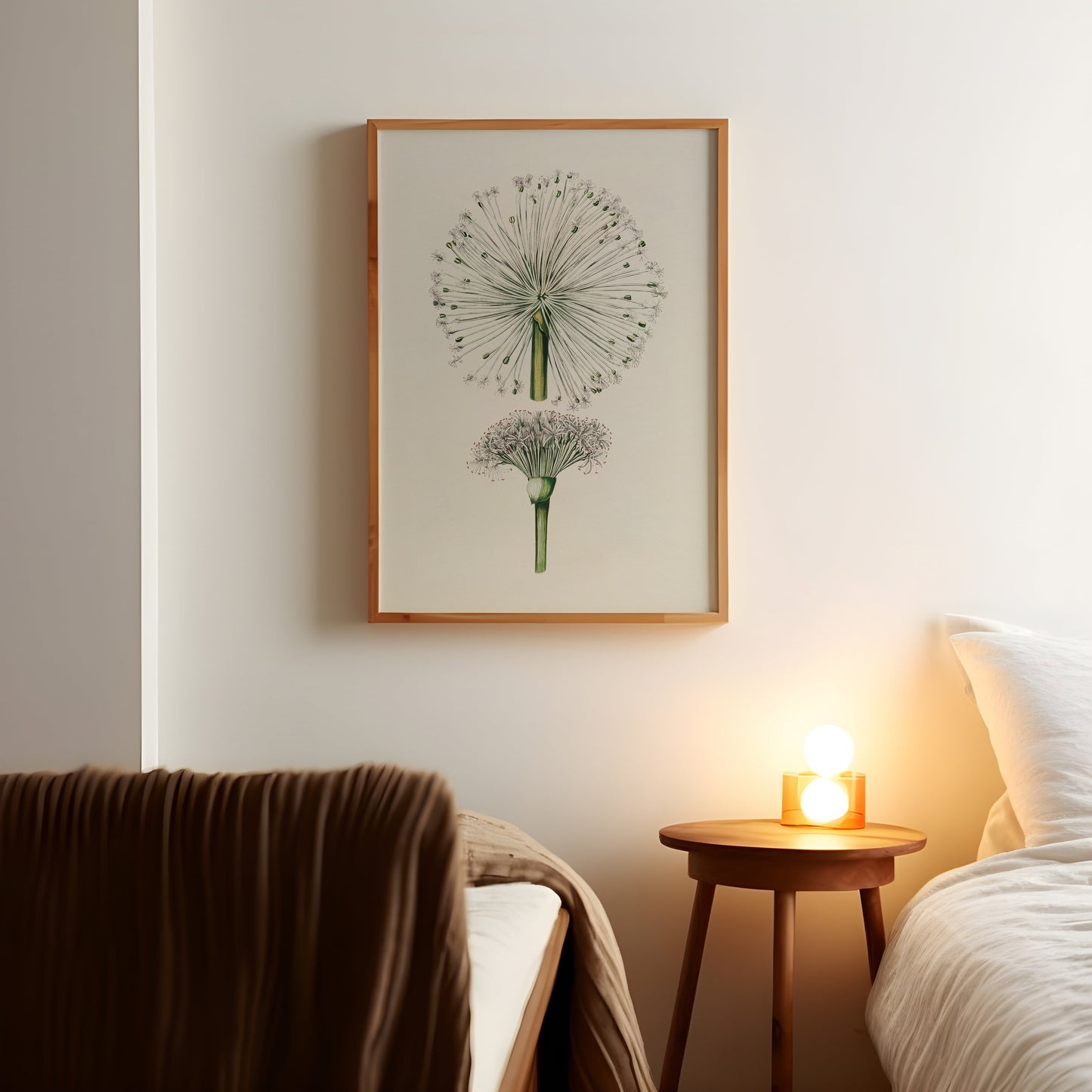 a picture of a dandelion on a wall above a bed
