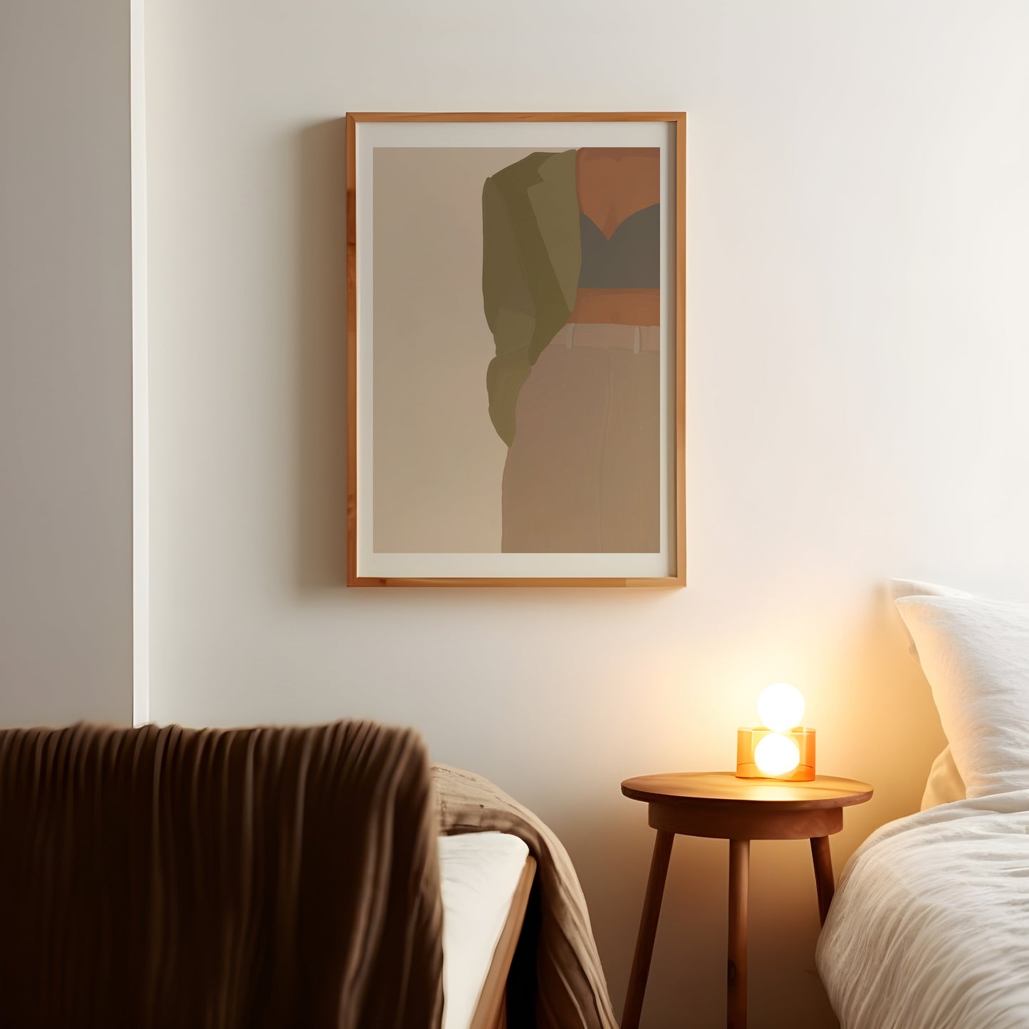 a bedroom with a bed and a picture hanging on the wall