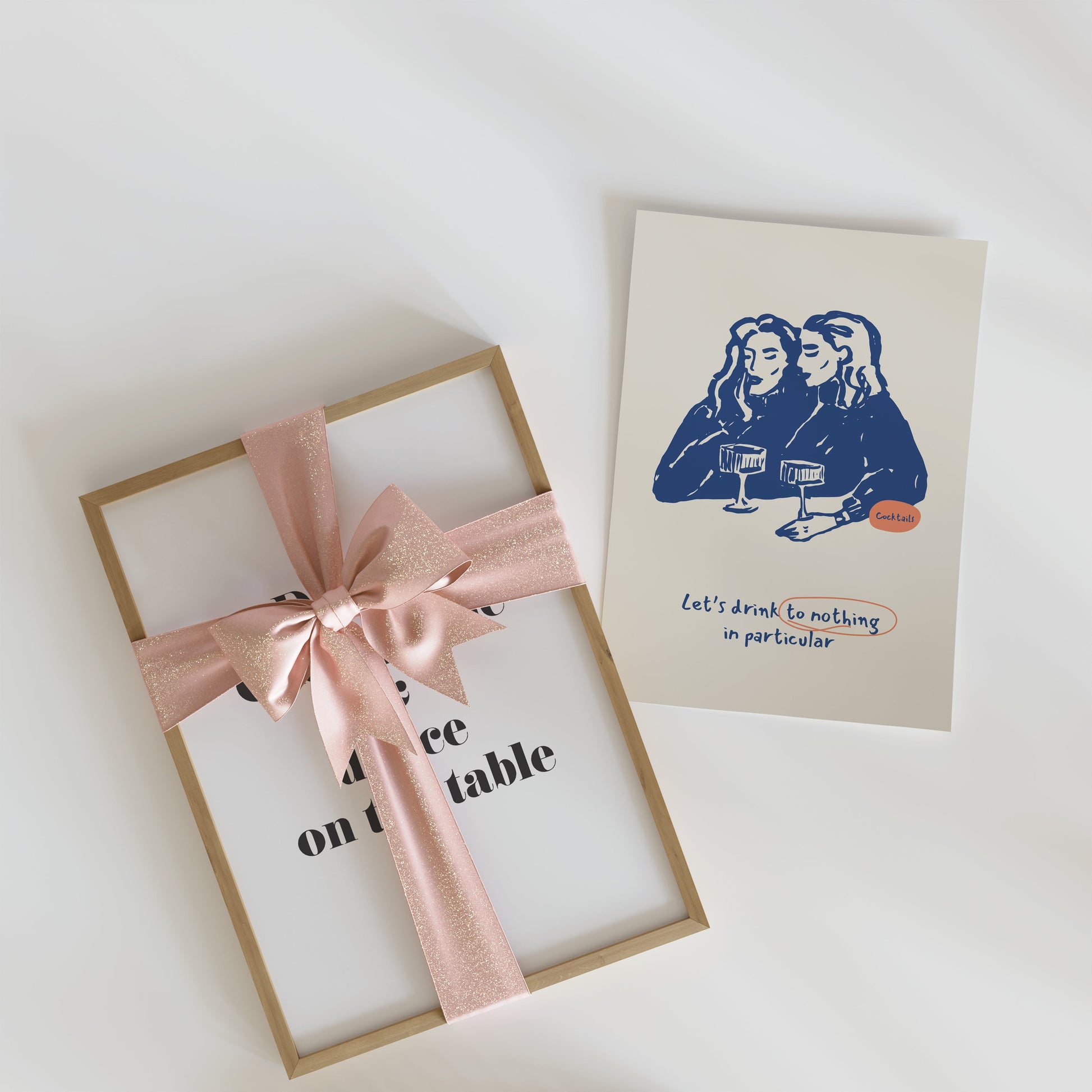 a card with a pink ribbon and a card with a picture of two women