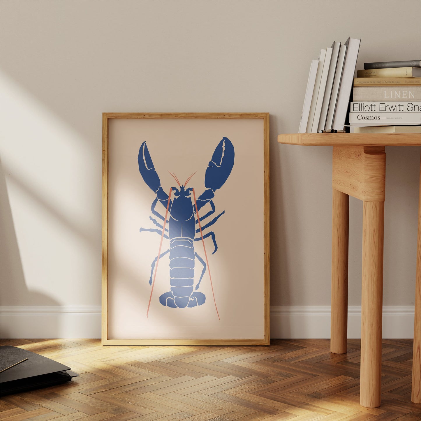 a framed picture of a lobster on a wall