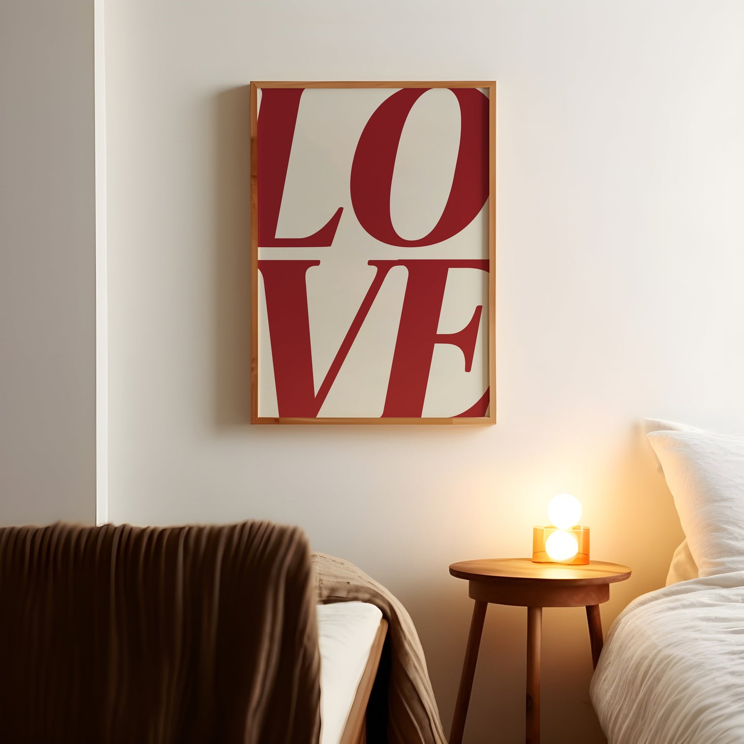 a bedroom with a bed and a love sign on the wall