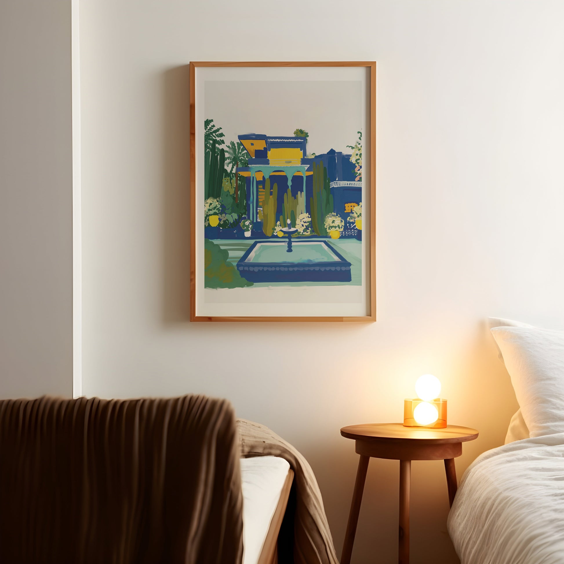 a picture hanging on a wall above a bed