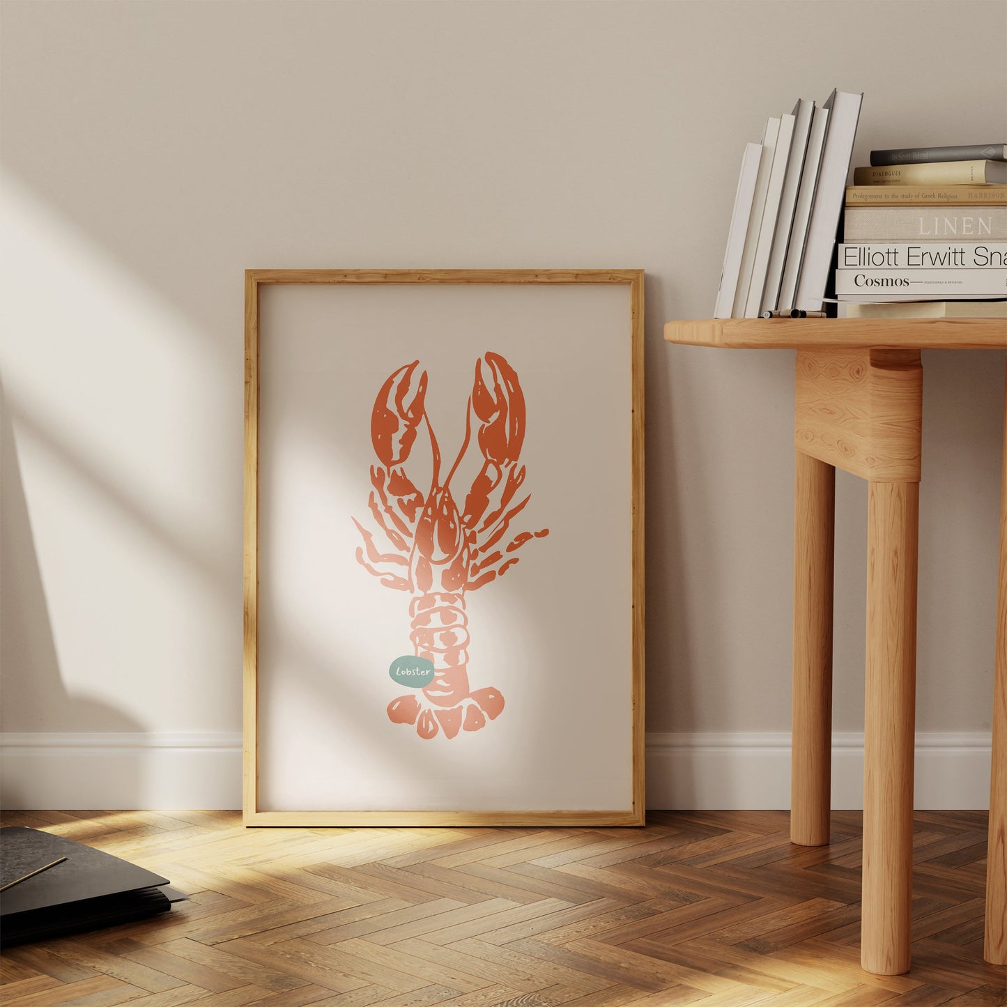 a picture of a lobster on a wall next to a table