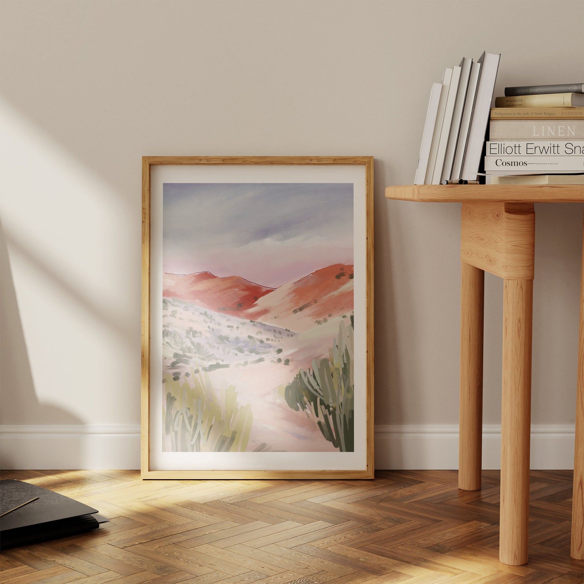 a picture of a desert landscape in a wooden frame