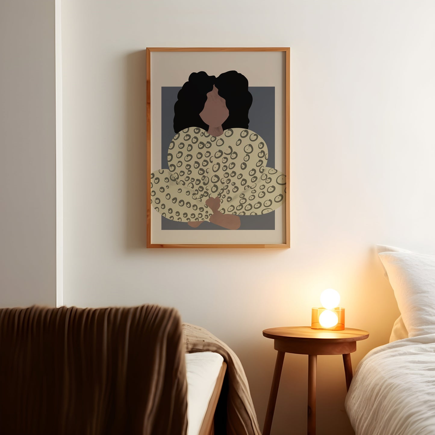 a picture of two people on a wall above a bed