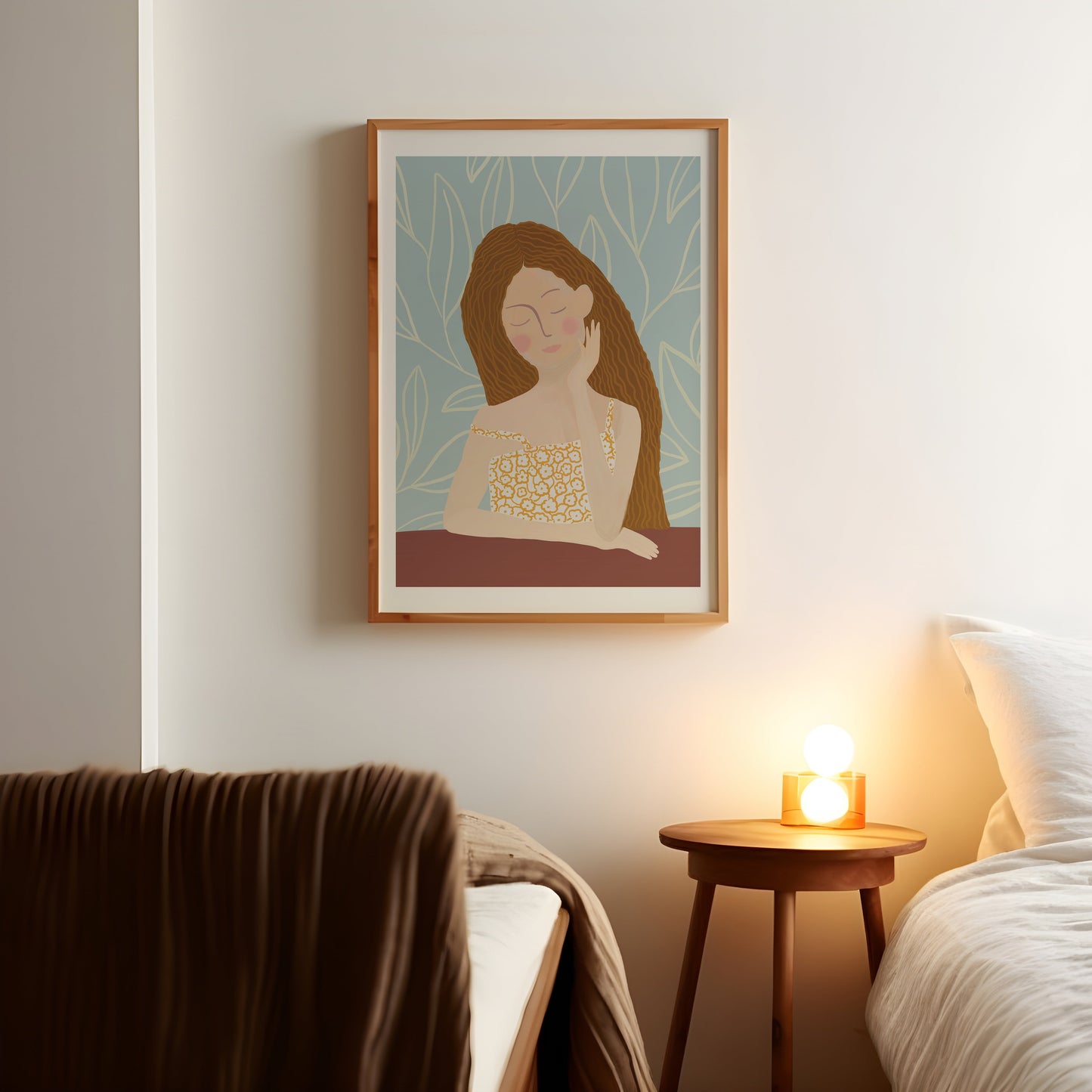 a picture of a woman on a wall above a bed