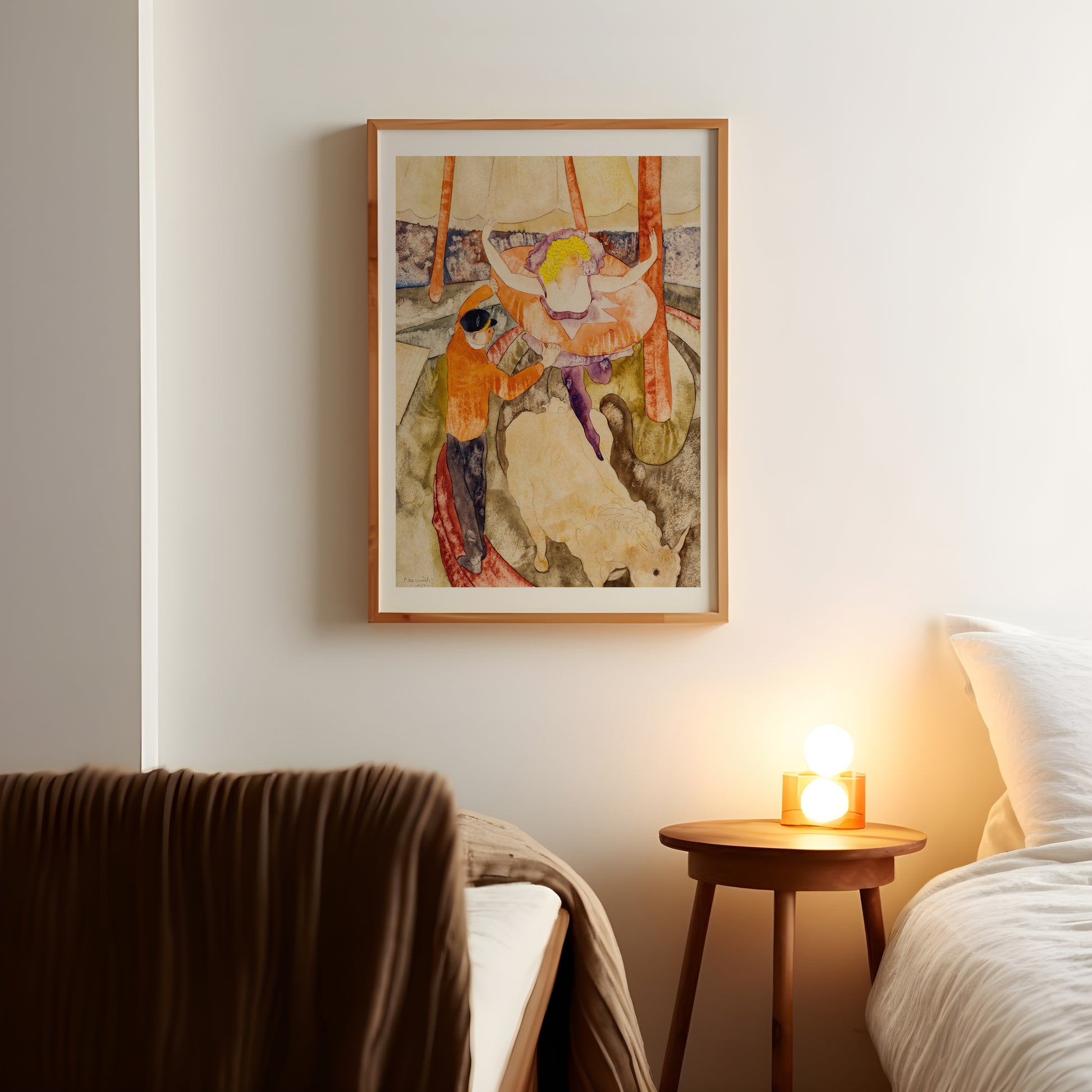 a painting hanging on a wall above a bed