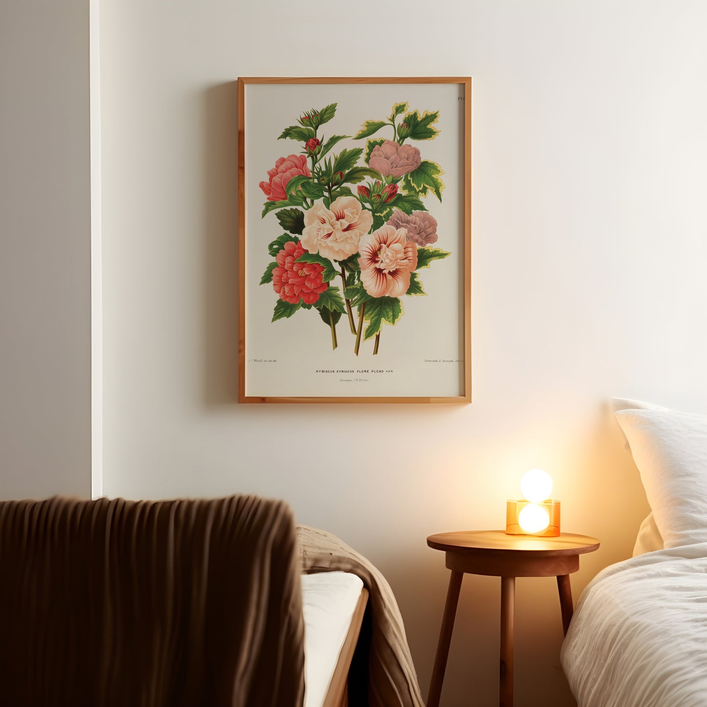 a picture of flowers on a wall above a bed