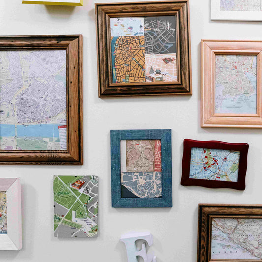 Variety of Maps in Wooden Frames Hanging on Wall