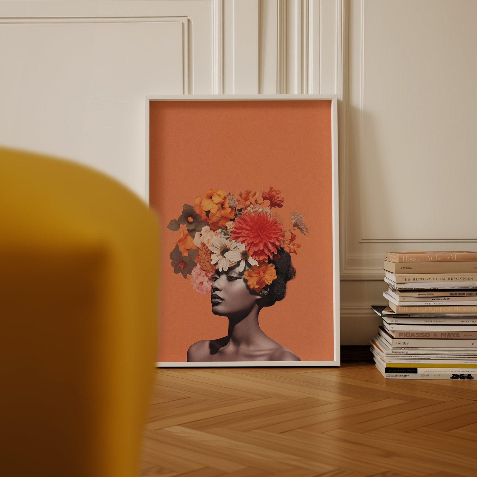 a picture of a woman with flowers on her head hangs above a bed